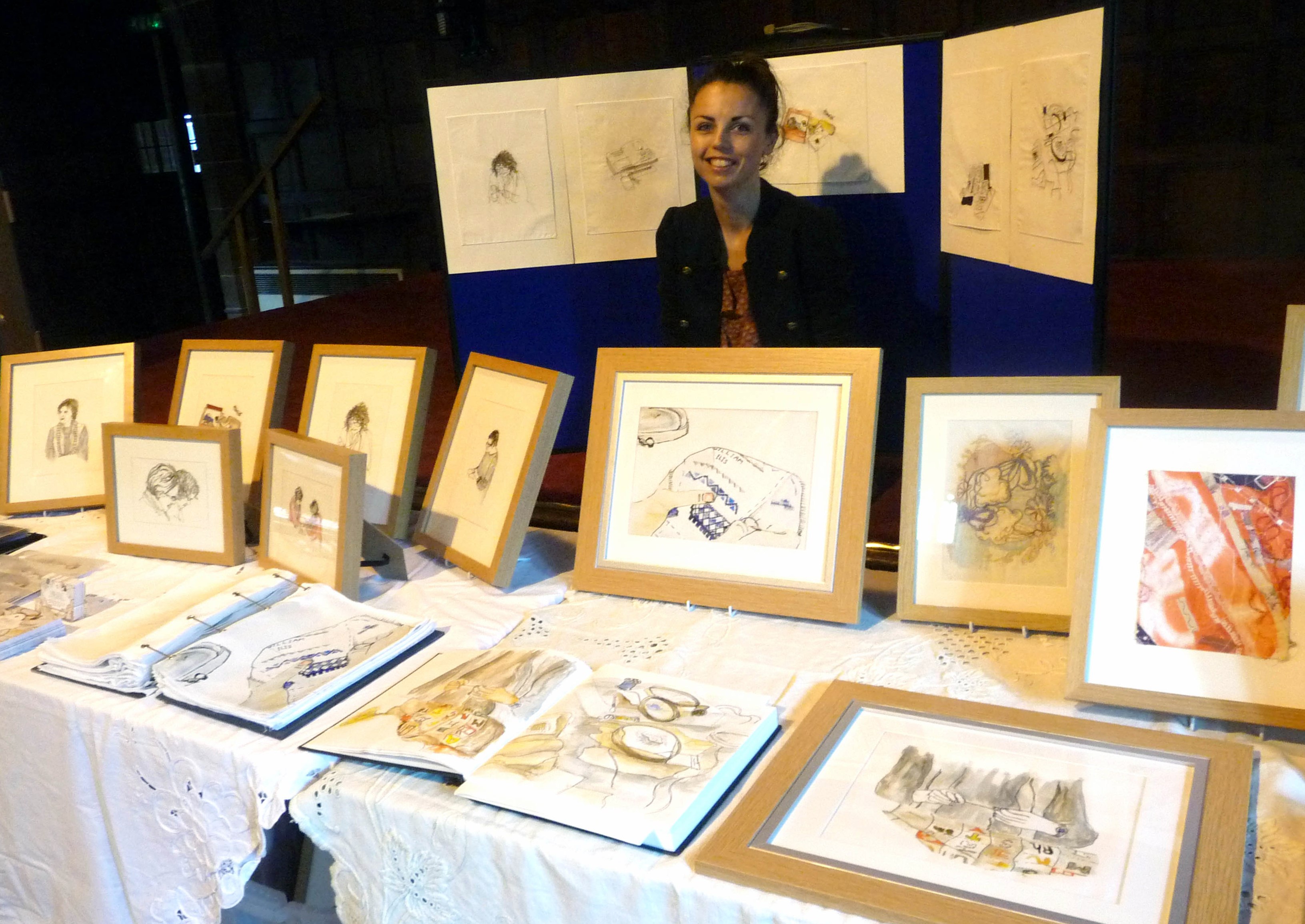Hanna Wyn Roberts with an exhibition of her embroidered pictures at 2014 September Tea Party