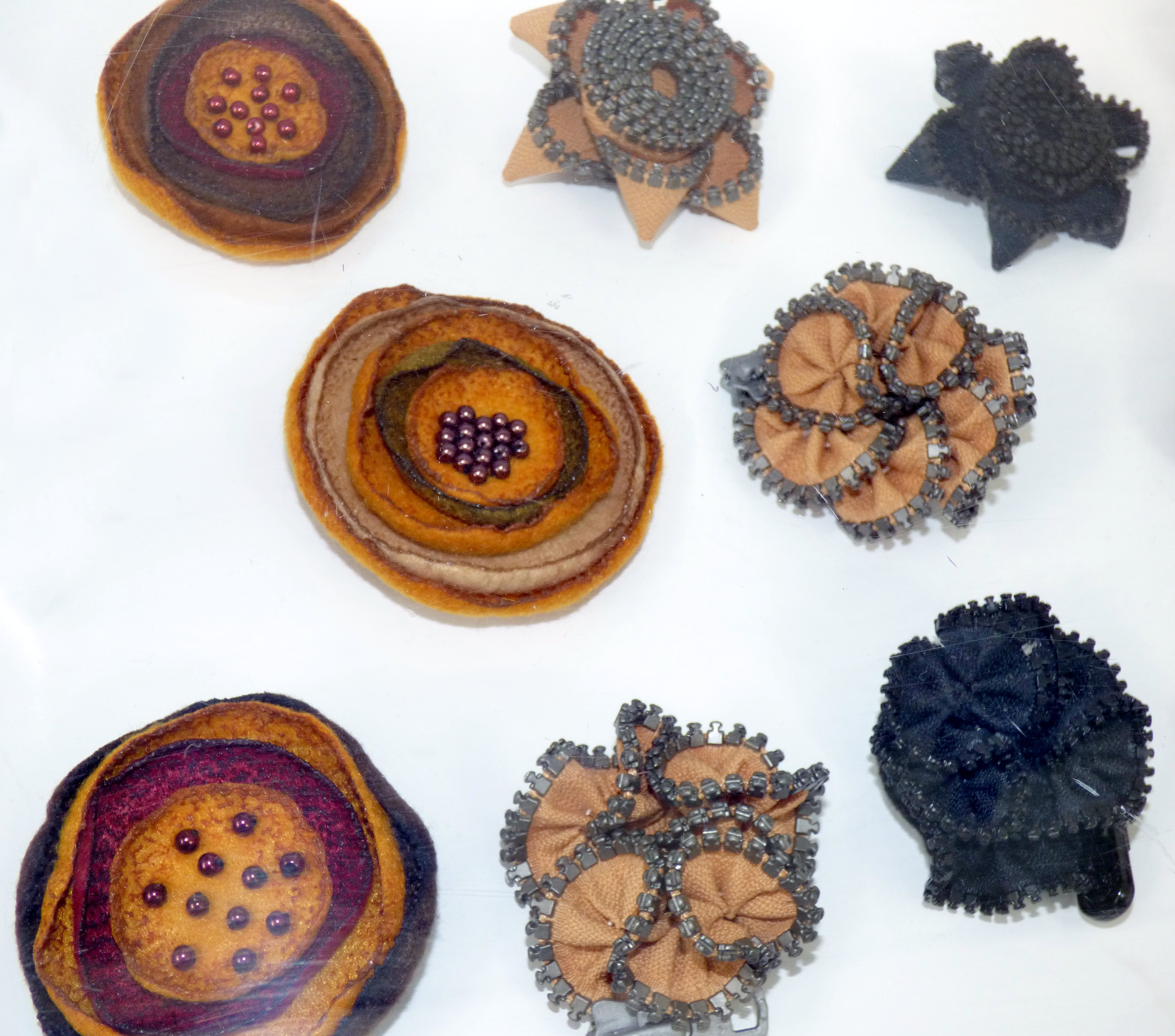 FABRIC BROOCHES by Tina Leahey, recycled textiles, CRAFTED exhibition, Huyton Gallery, 2016
