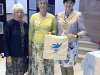 Rubina Porter MBE, Kim Parkman and Cllr. Roz Gladden, Lord Mayor of Liverpool with MEG cotton bag made in Sreepur at 60 Glorious Years exhibition in Liverpool Cathedral