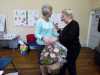 Kim Parkman is presented with flowers by new Chair Vicky Williams at AGM 2017