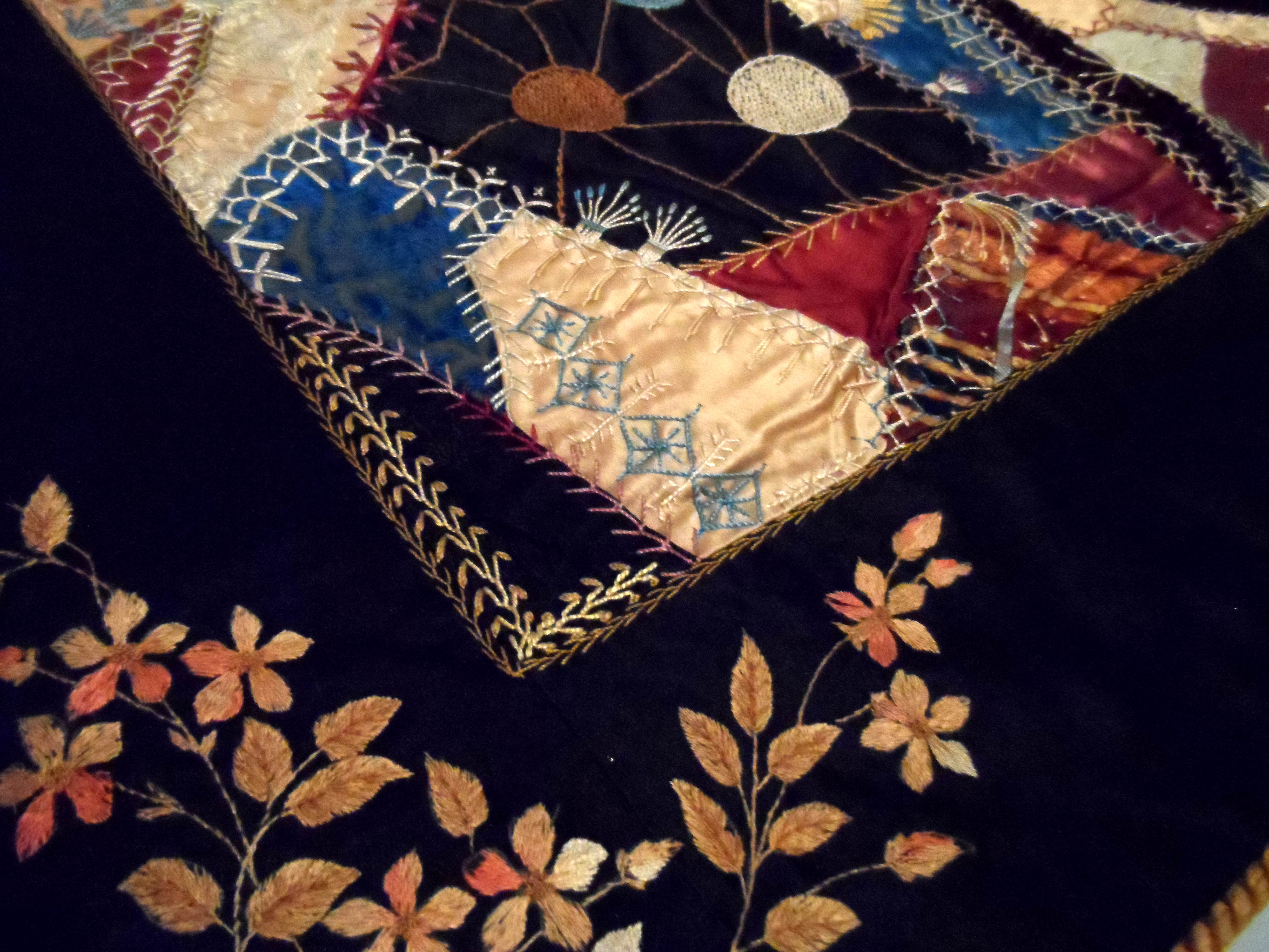 detail of embroidered CRAZY PATCHWORK QUILT