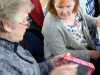 Val Heron is demonstrating ladder stitch at MEG Napkin Box Workshop with Val Heron