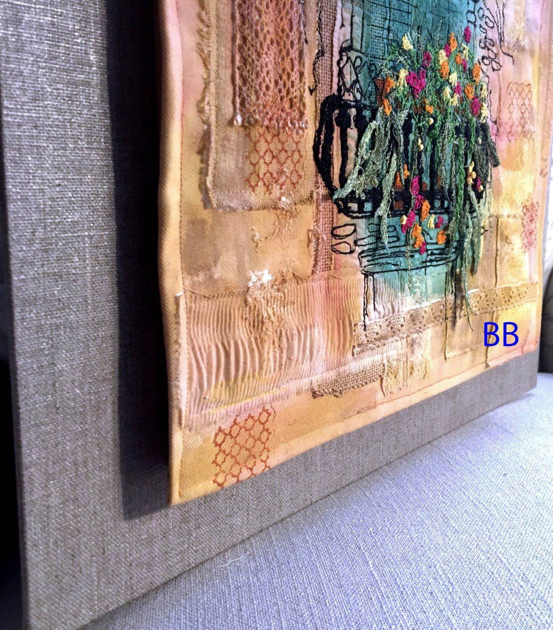 A GLIMPSE OF VENICE, painted pieced surface, worked by machine and some hand stitching. The foliage is worked on soluble fabric and attached when dissolved to give a 3 D effect.