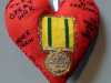 TERRITORIAL WAR MEDAL 1914-19 by Helen Livesey, in memory of all who were awarded, 100 Hearts exhibition, Liverpool Cathedral, Sept 2018