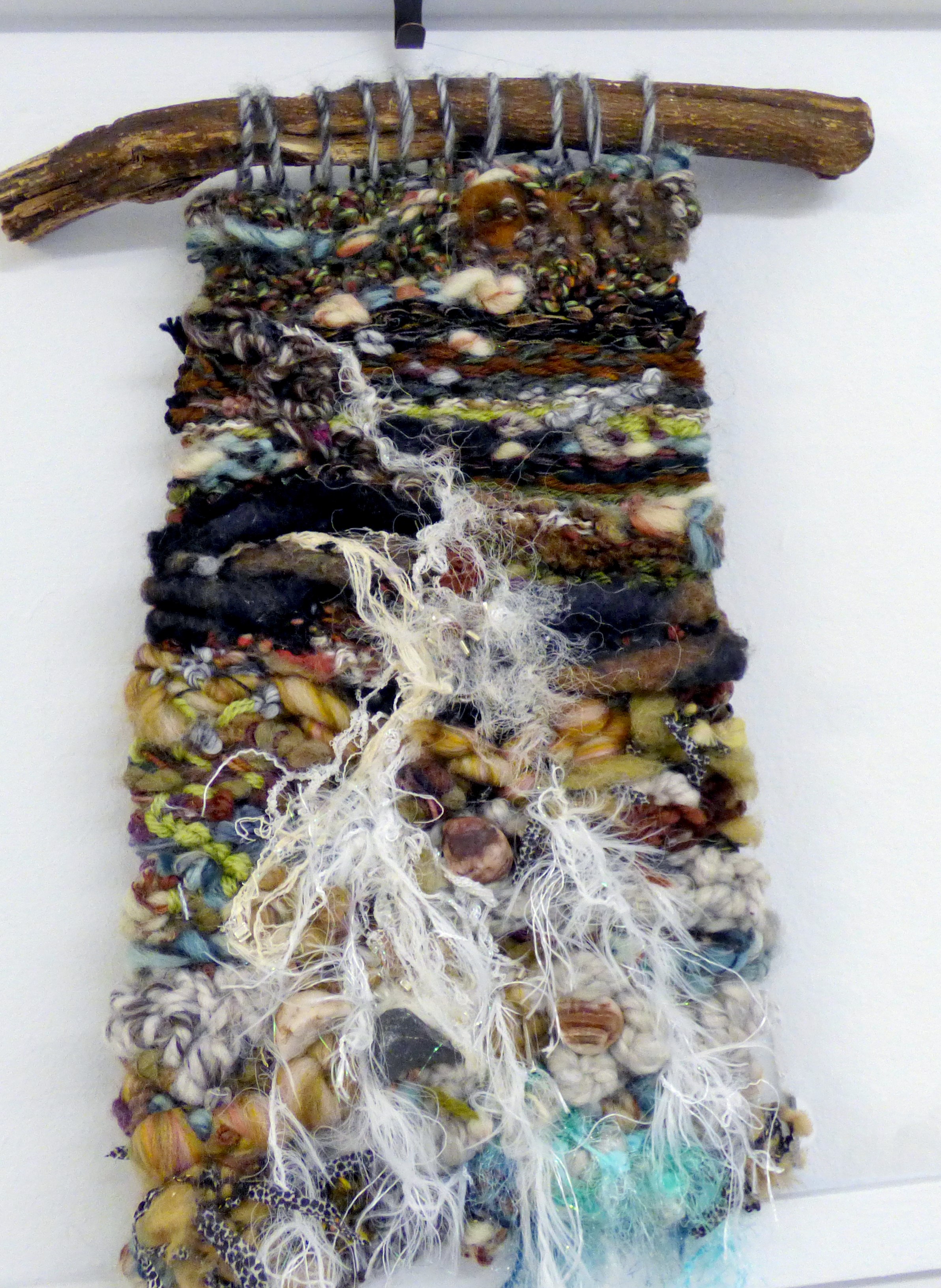 THE SOURCE IN THE HILLS by Janet Vance, woven hanging with pebbles and yarns, ConText group 2018