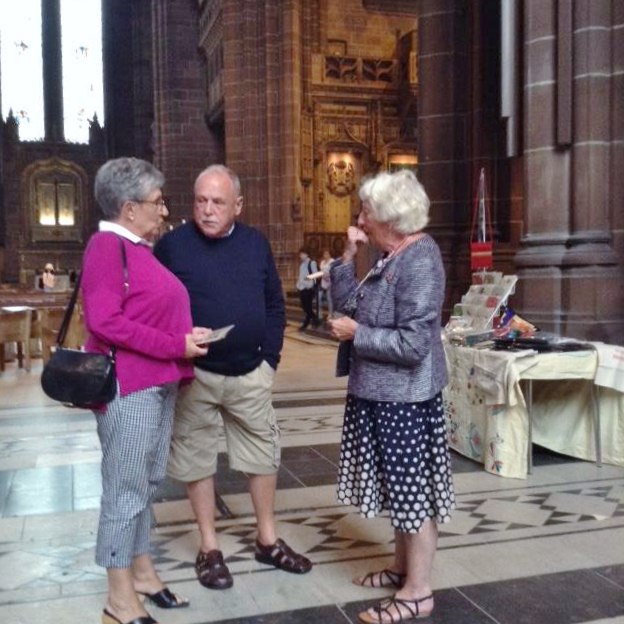 Rubina Porter MBE is talking with Dame Sarah Storey's parents at Threading Dreams exhibition, Liverpool Cathedral, July 2018