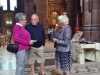 Rubina Porter MBE is talking with Dame Sarah Storey's parents at Threading Dreams exhibition, Liverpool Cathedral, July 2018