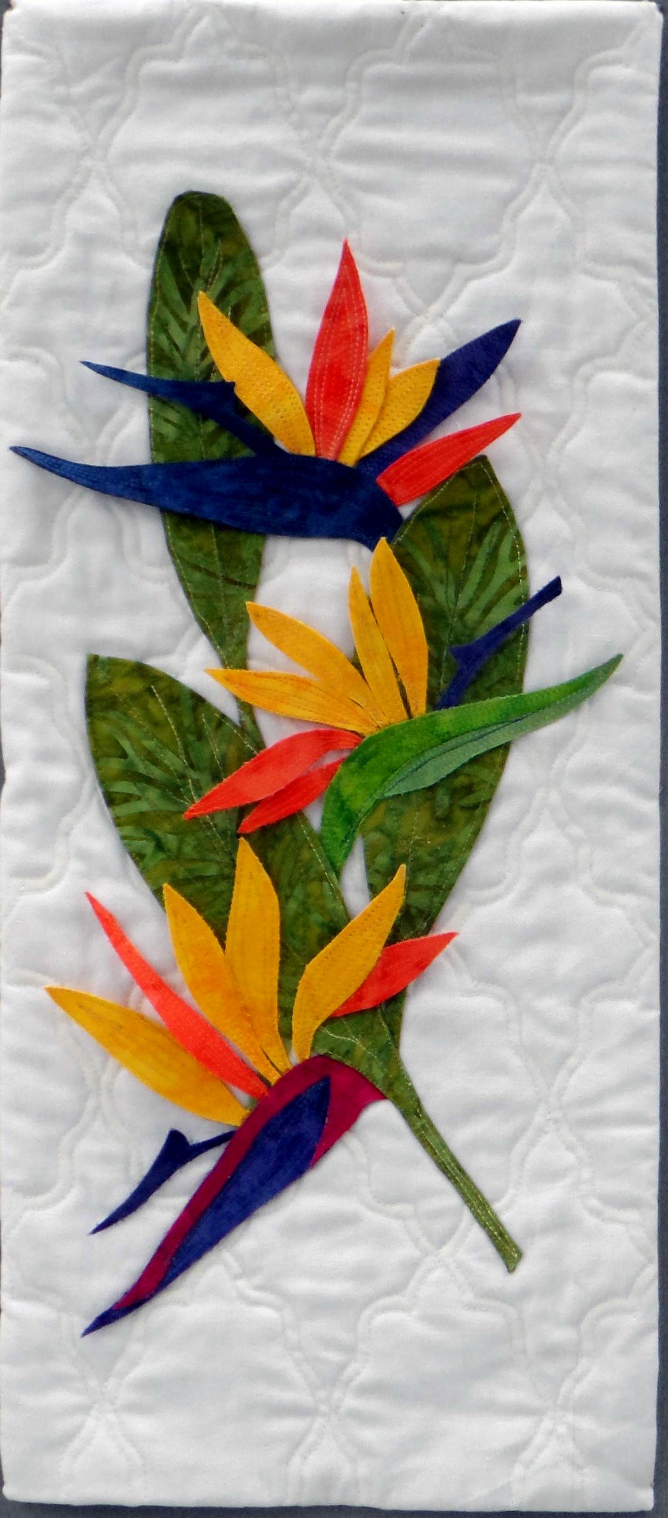 EXOTIC BIRDS OF PARADISE by Ann Beech, machine quilted background with added machine quilted leaves, Contemporary Threads exhibition, Sefton Palm House, Feb 2022