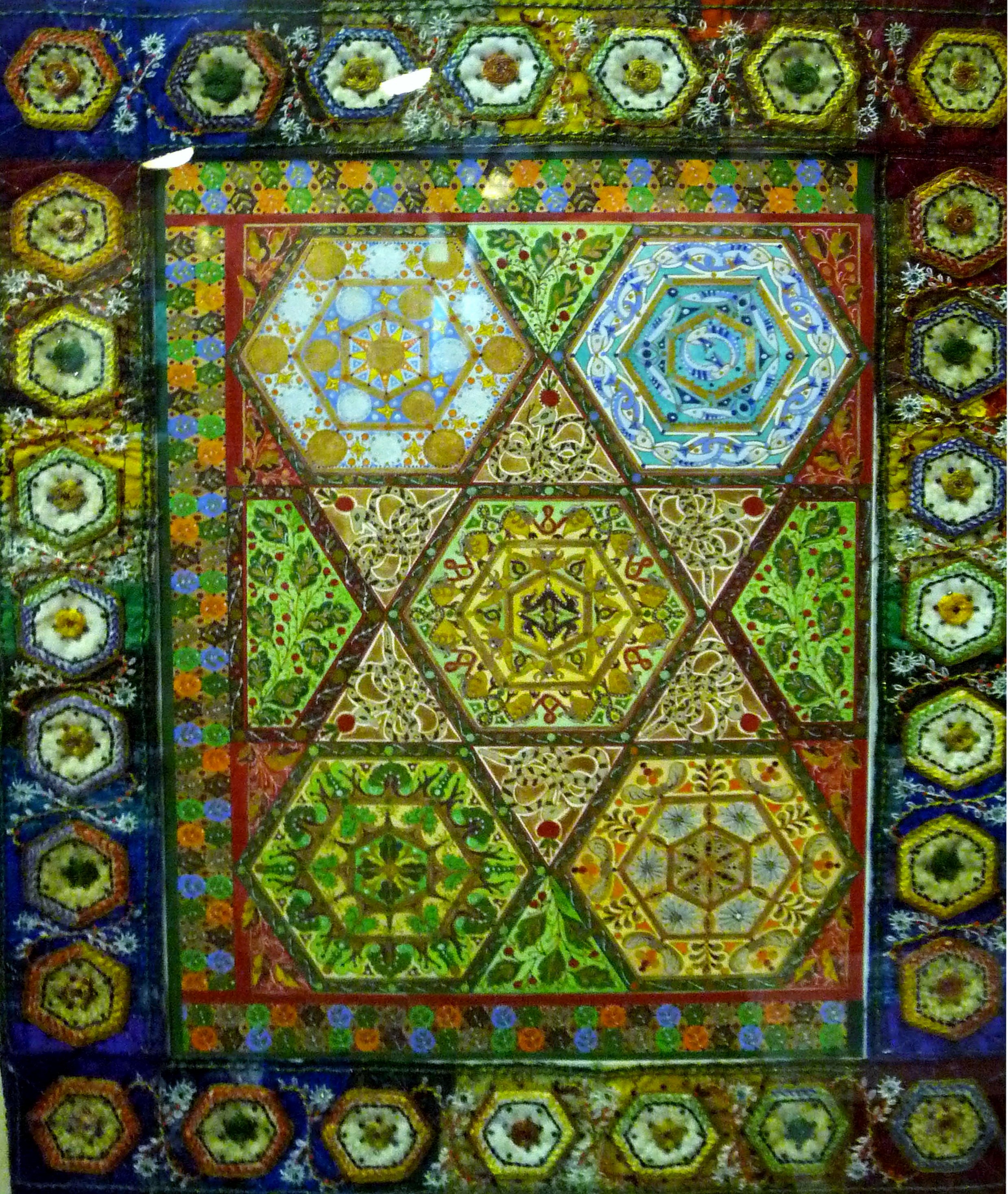 CREATION: A CELEBRATION by Sue Symonds, CARPET PAGE: CREATION MEDLEY (double spread) , painting with embroidered frame