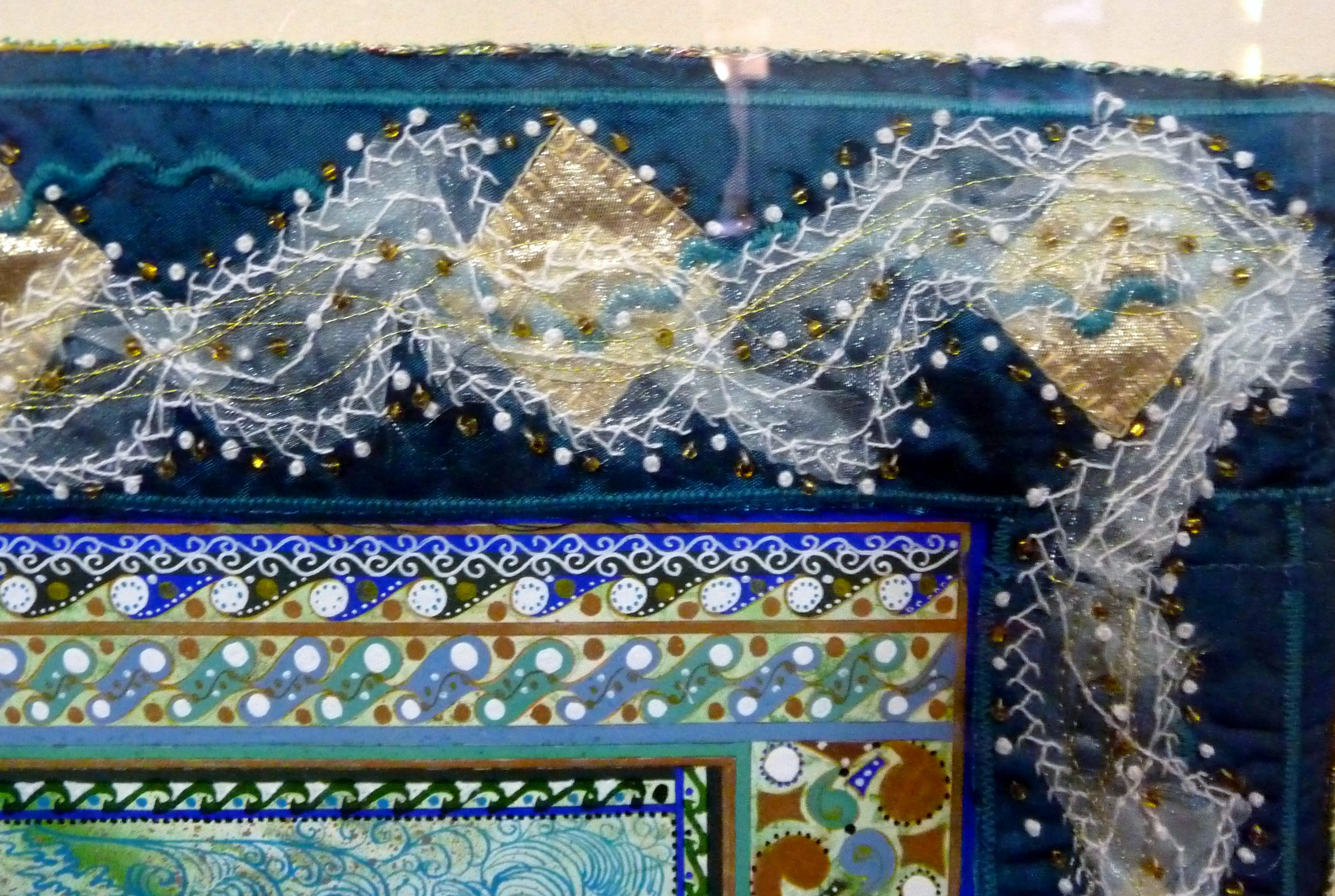 (detail) CREATION: A CELEBRATION by Sue Symonds, EARTH AND SEA, painting with embroidered frame