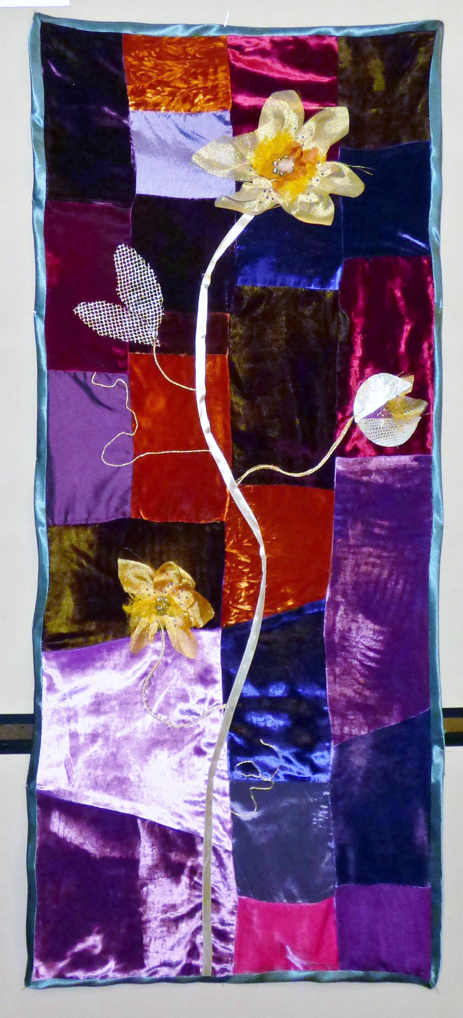 FLOWERS ON A STAINED GLASS PANEL by Sarah Lowes, silk velvet, chiffon, silk, gold work, beads, Exhibition at All Hallows Church, September 2022