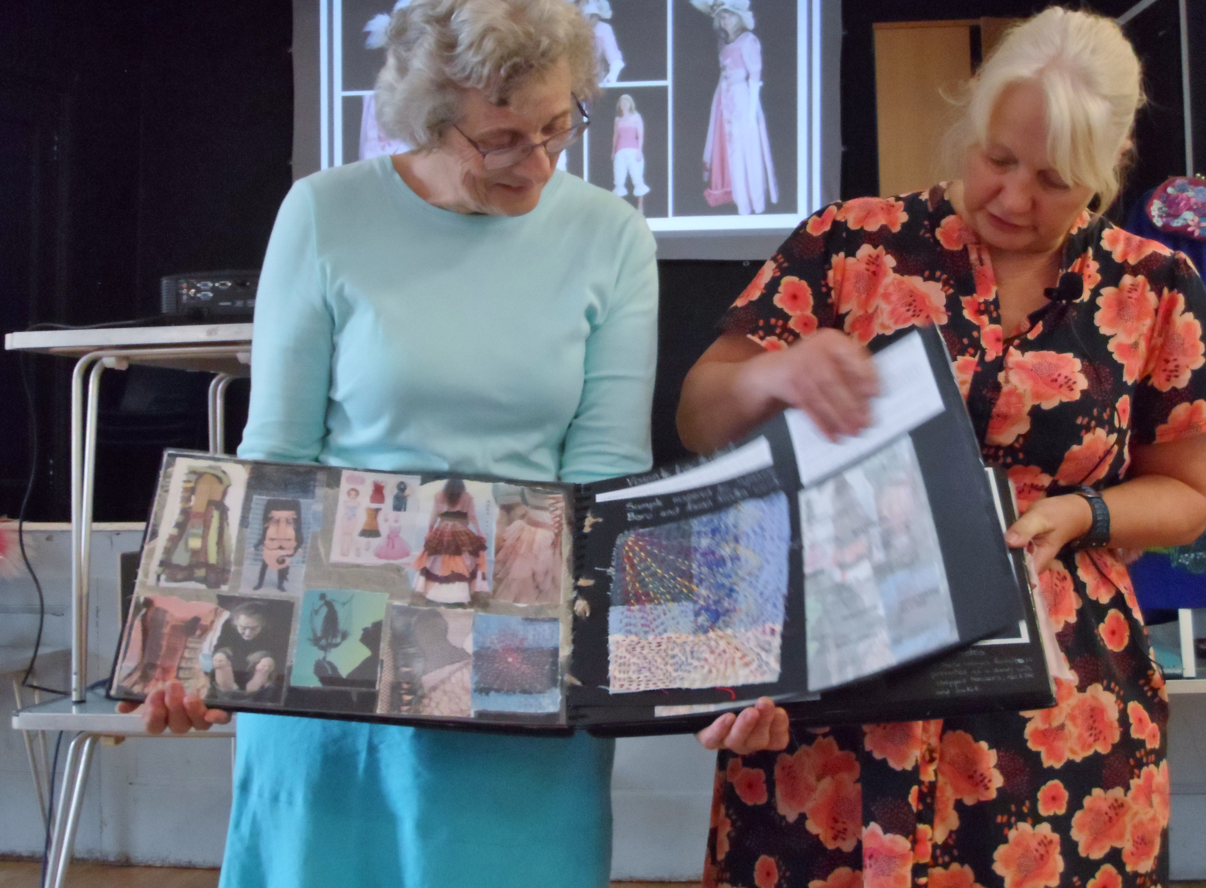 Kim am Liz with a sketchbook of costume design, "From Stitch to Stage," TALK by Elizabeth Shelbourne, June 2023