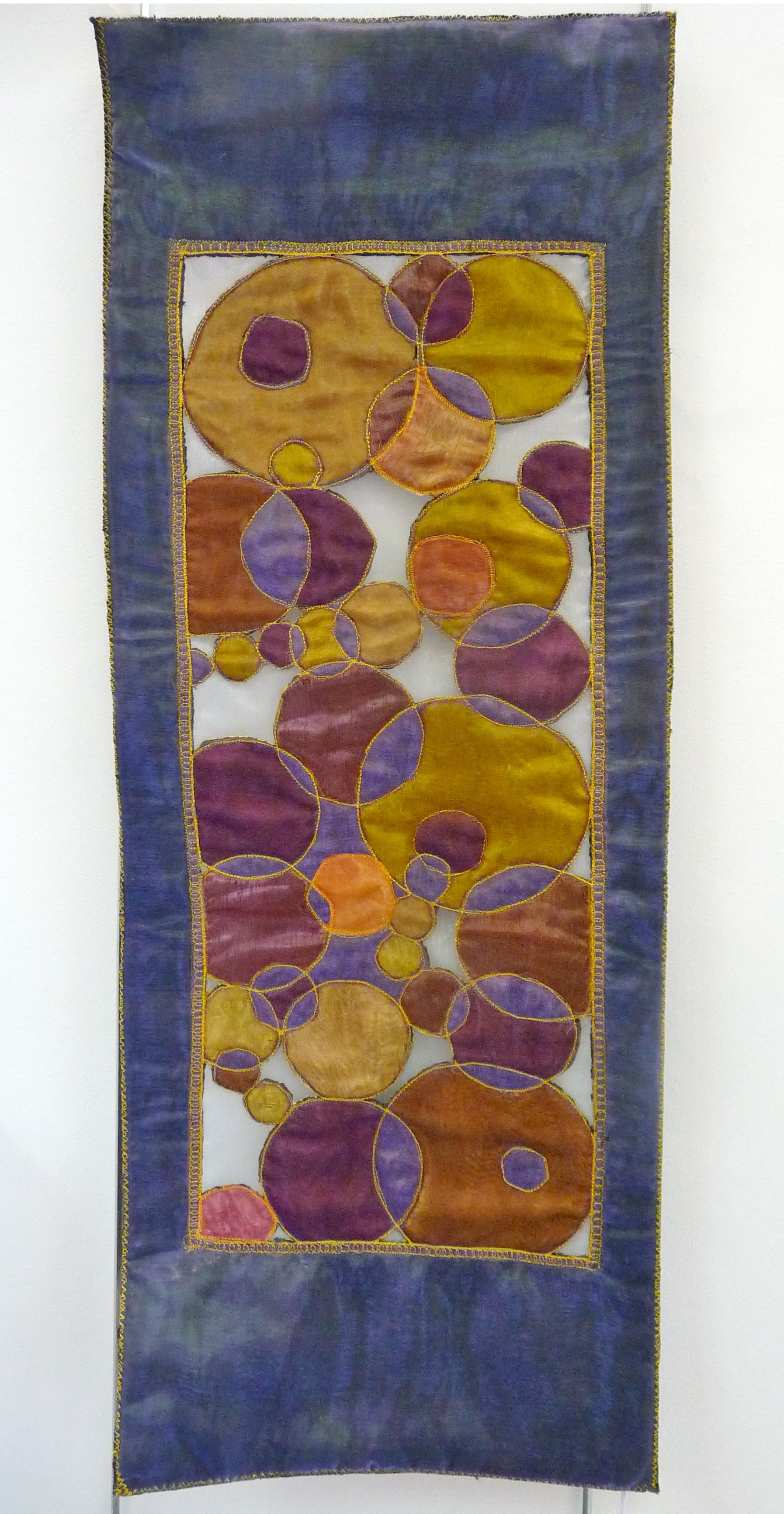 PLANETS COLLIDING by Eileen Norris, organza cutwork hanging