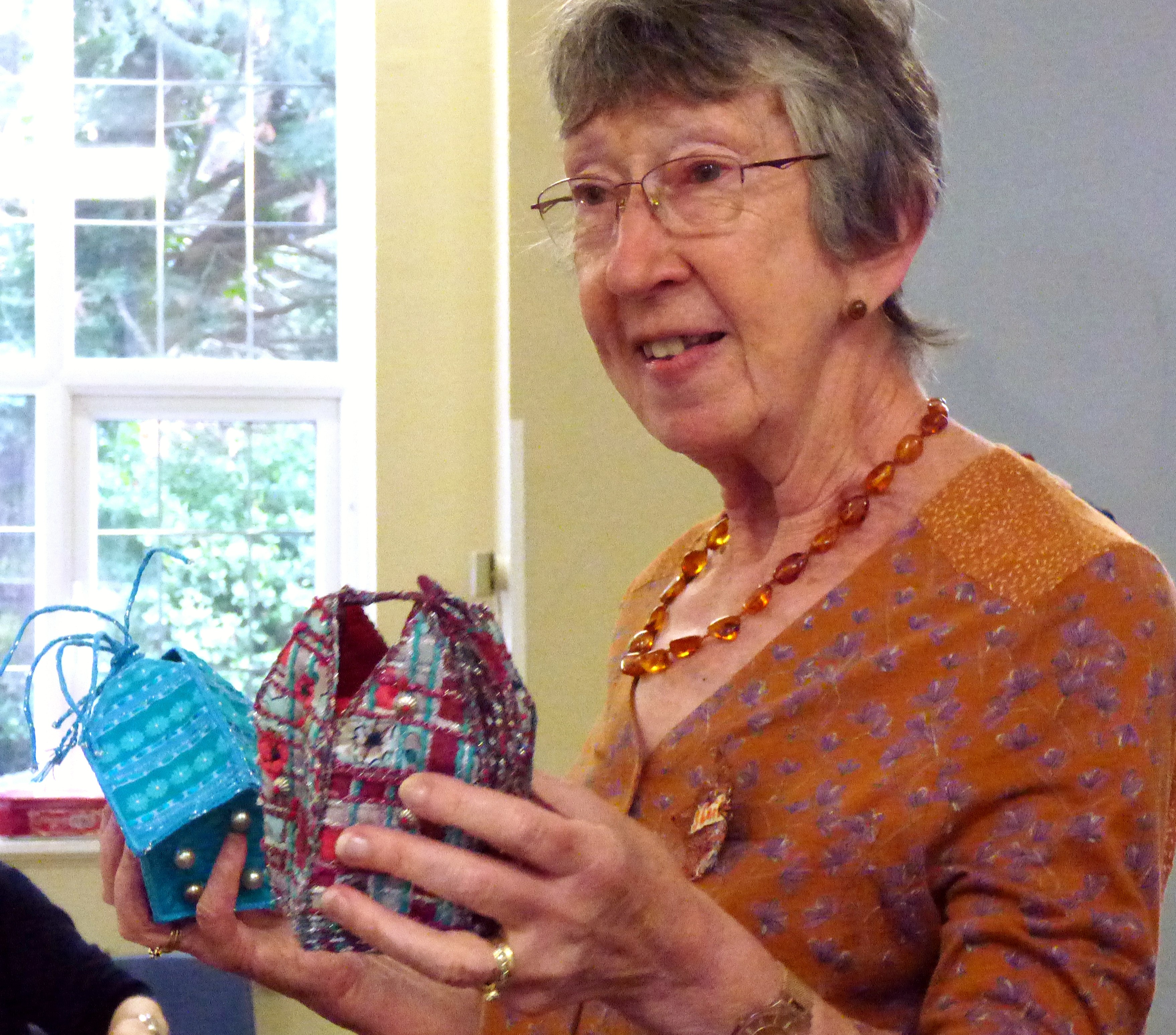 Our Tutor Sheila Conchie showing some samples of her work, at 5 sided casket workshop, July 2019