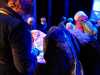 an admiring crowd with a Kaffe Fassett quilt, Kaffe Fassett Lecture, Capstone Theatre, Dec 2016