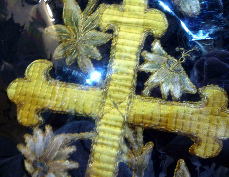 detail of goldwork embroidery by Leek School of Embroidery in St Edward the Confessor Church, Leek. This example is stored behind glass