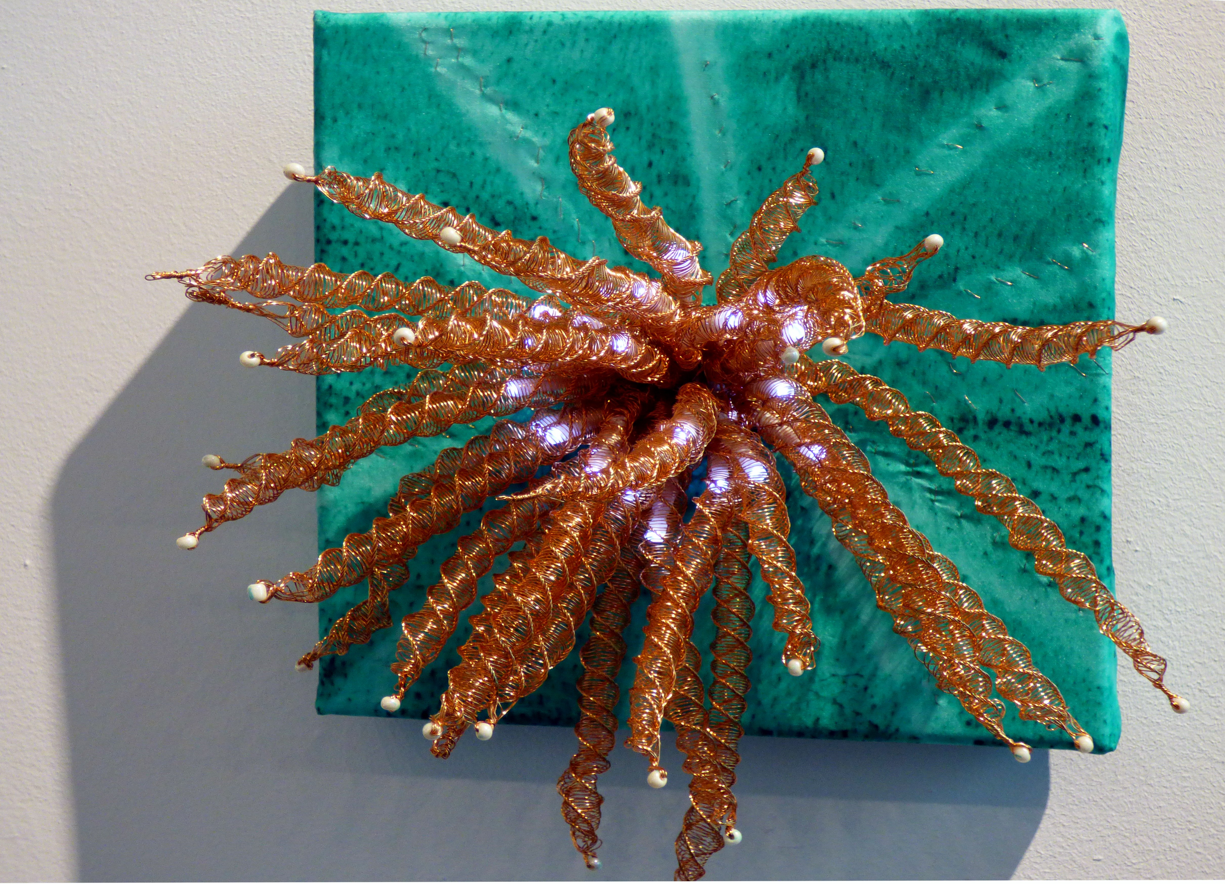 SPIRALS OF LIGHT by Sue Reeve, copper wire, beads, silk & LCD lights , Textile 21 at World of Glass, St Helens 2016