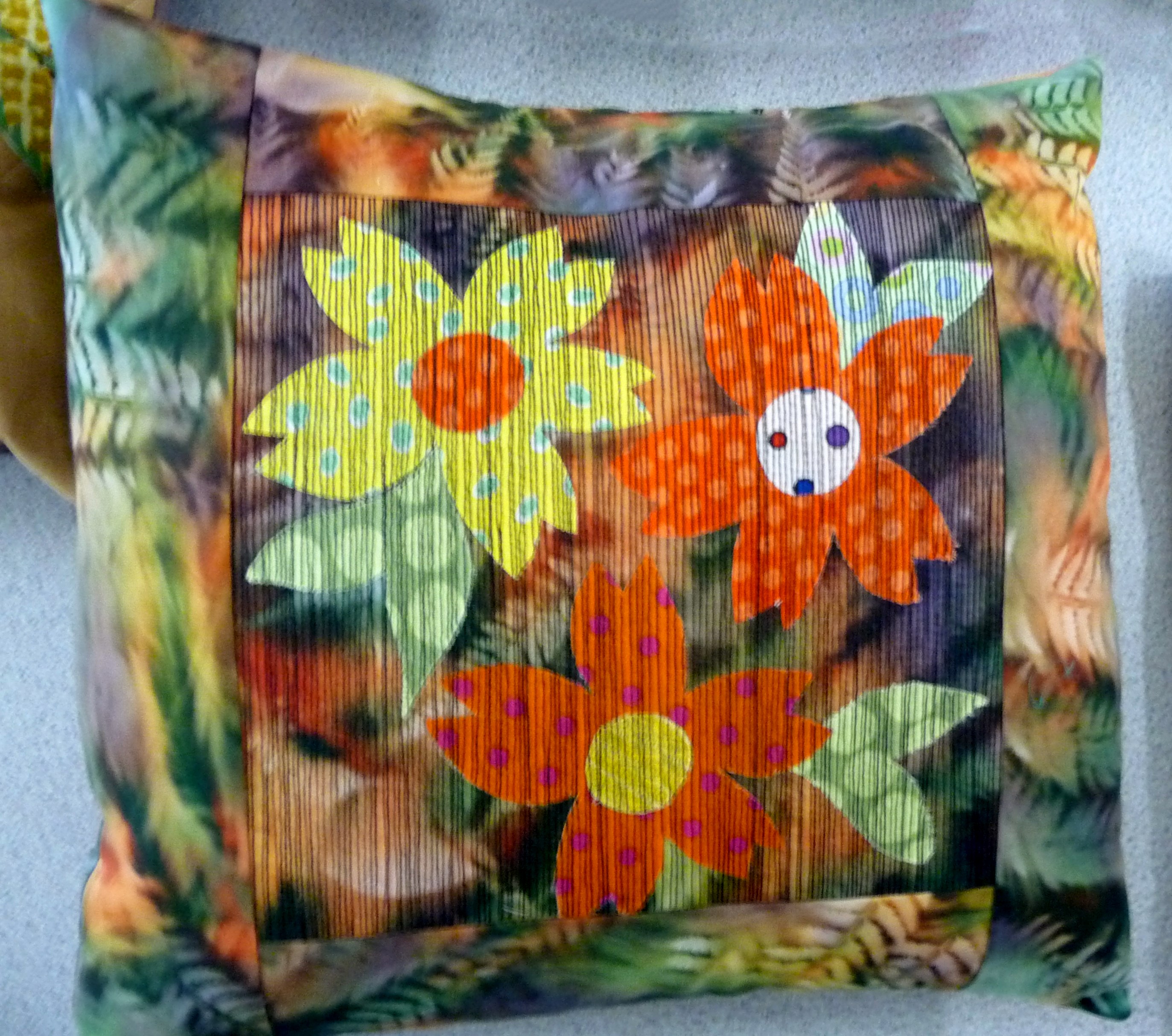 applique cushion with machine embroidery by Norma Heron