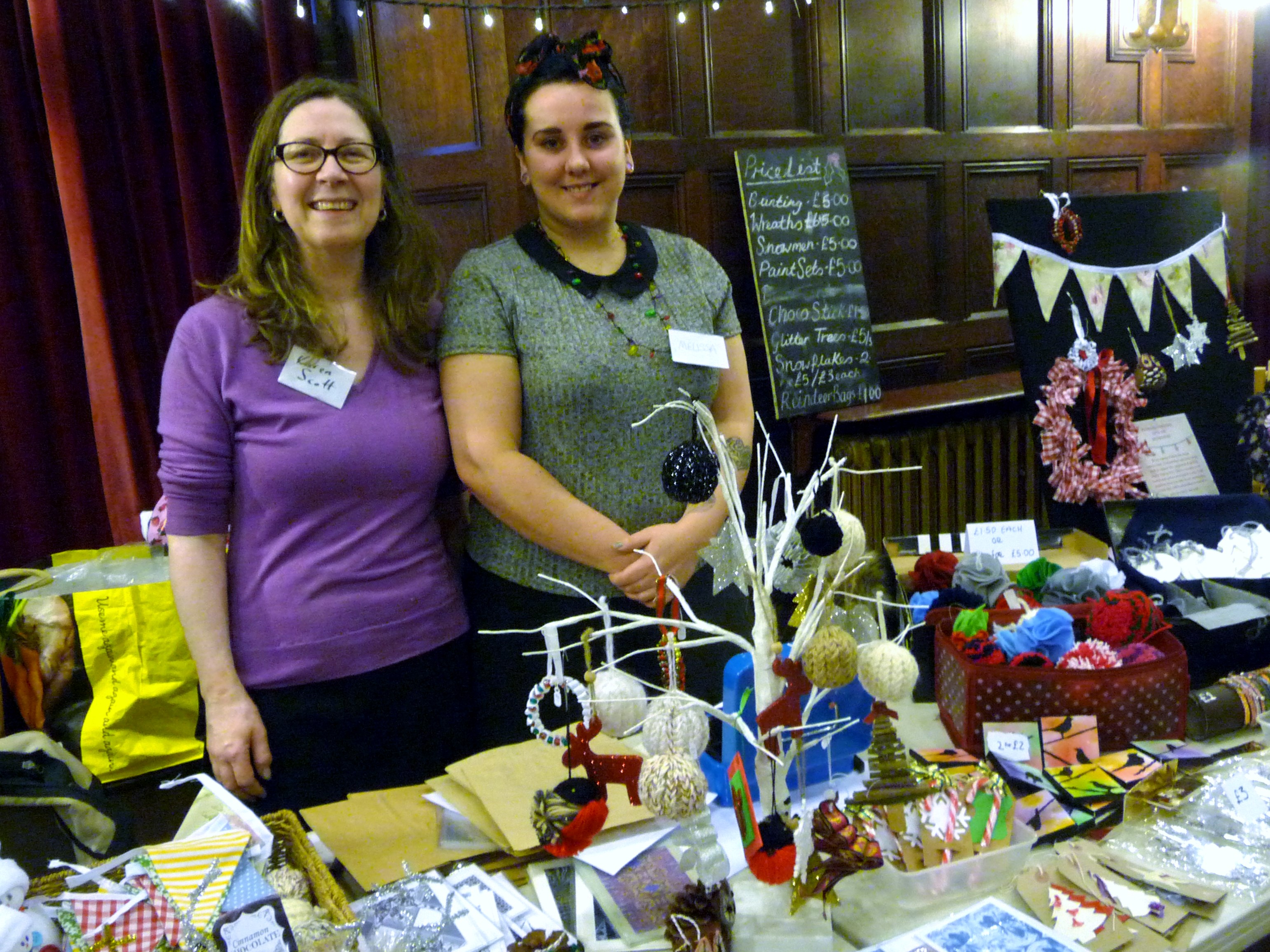 MEG Christmas Party 2015- Karen Scott and Melissa Courtney with their Hope University stall