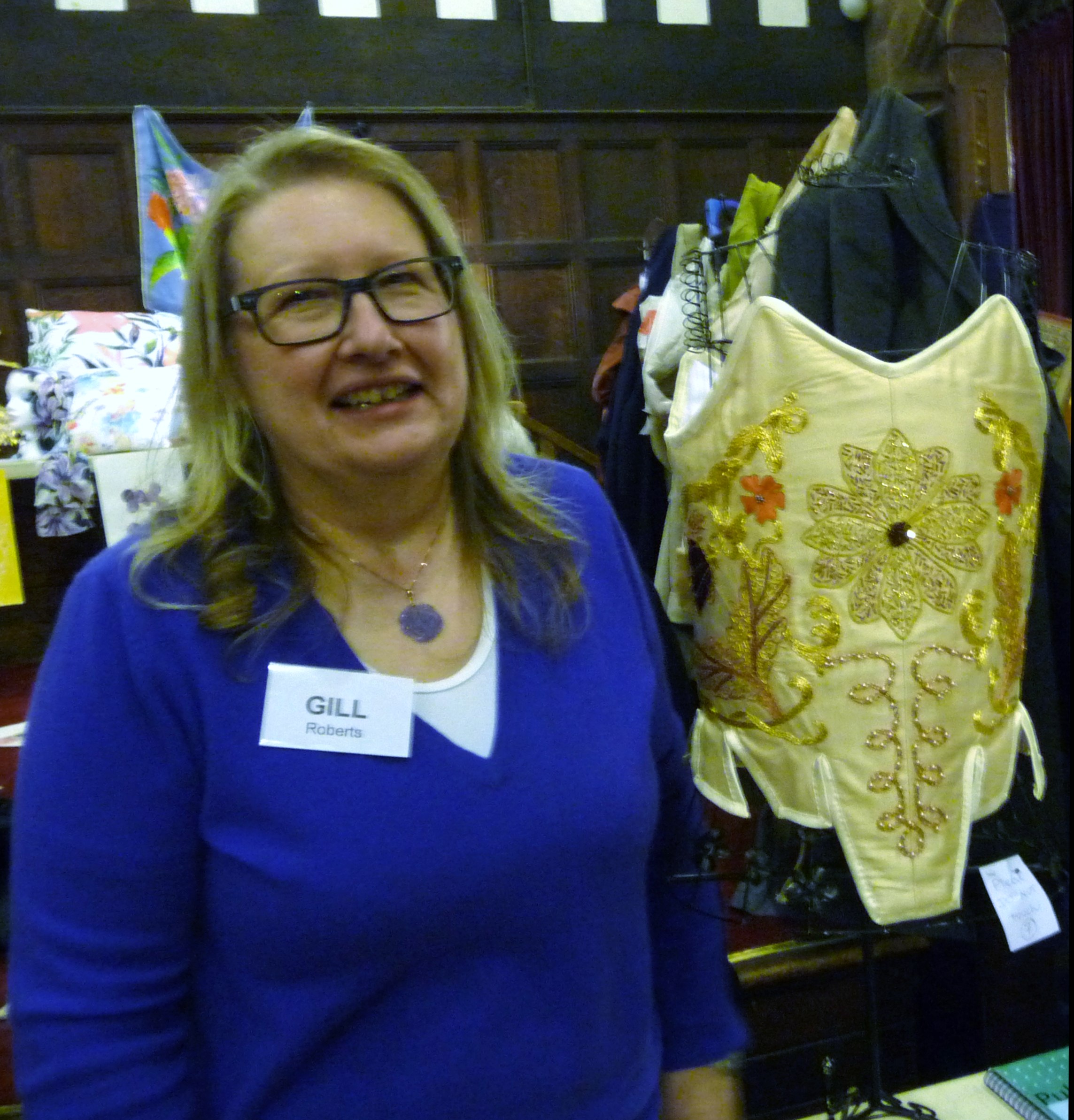 MEG Christmas Party 2015- Gill Roberts with her goldwork corset which won First Prize in the Traditional Embroidery competition
