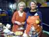 Sarah and Helen ready to welcome customers at the homemade cake stall, MEG Christmas Party 2017