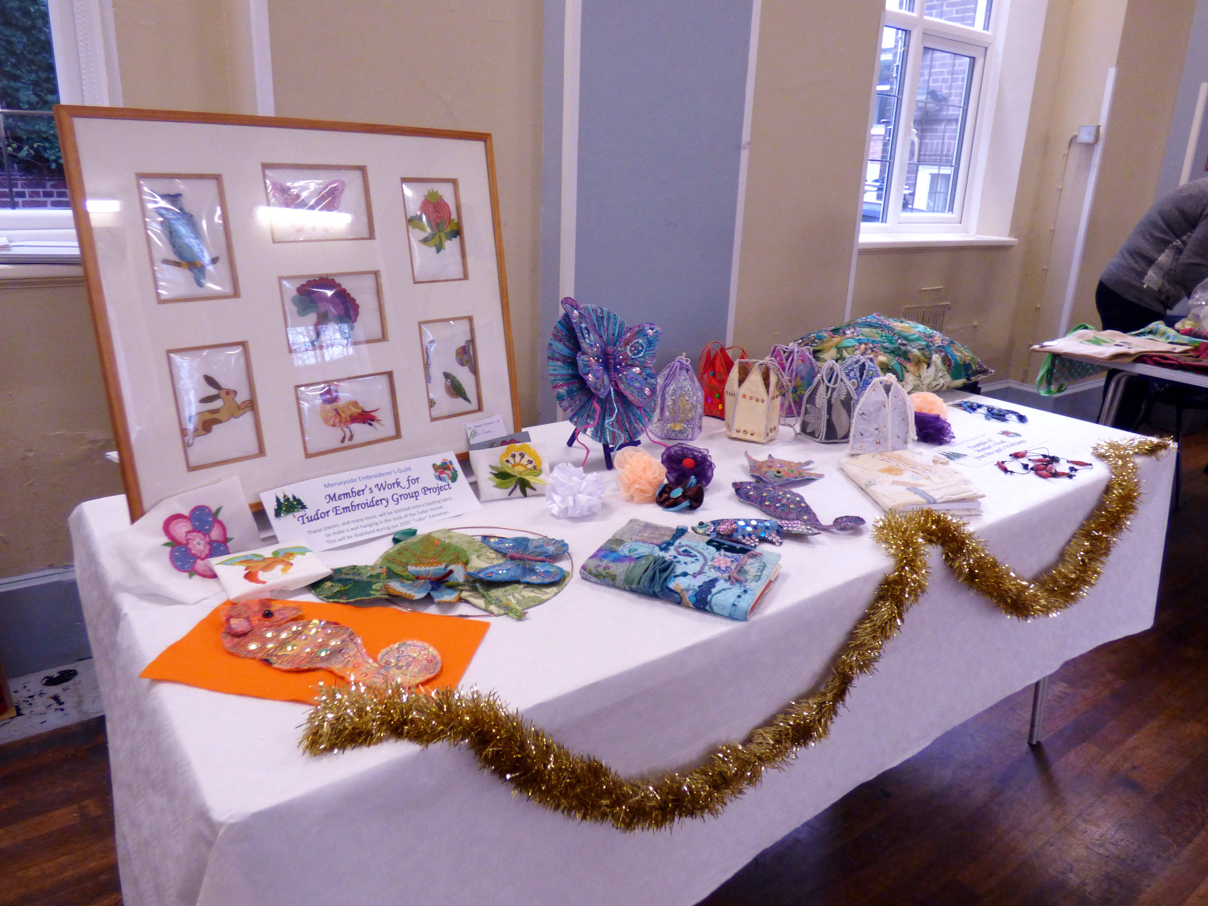 display of Workshop work and Tudor embroidery group project at MEG Christmas Party 2019
