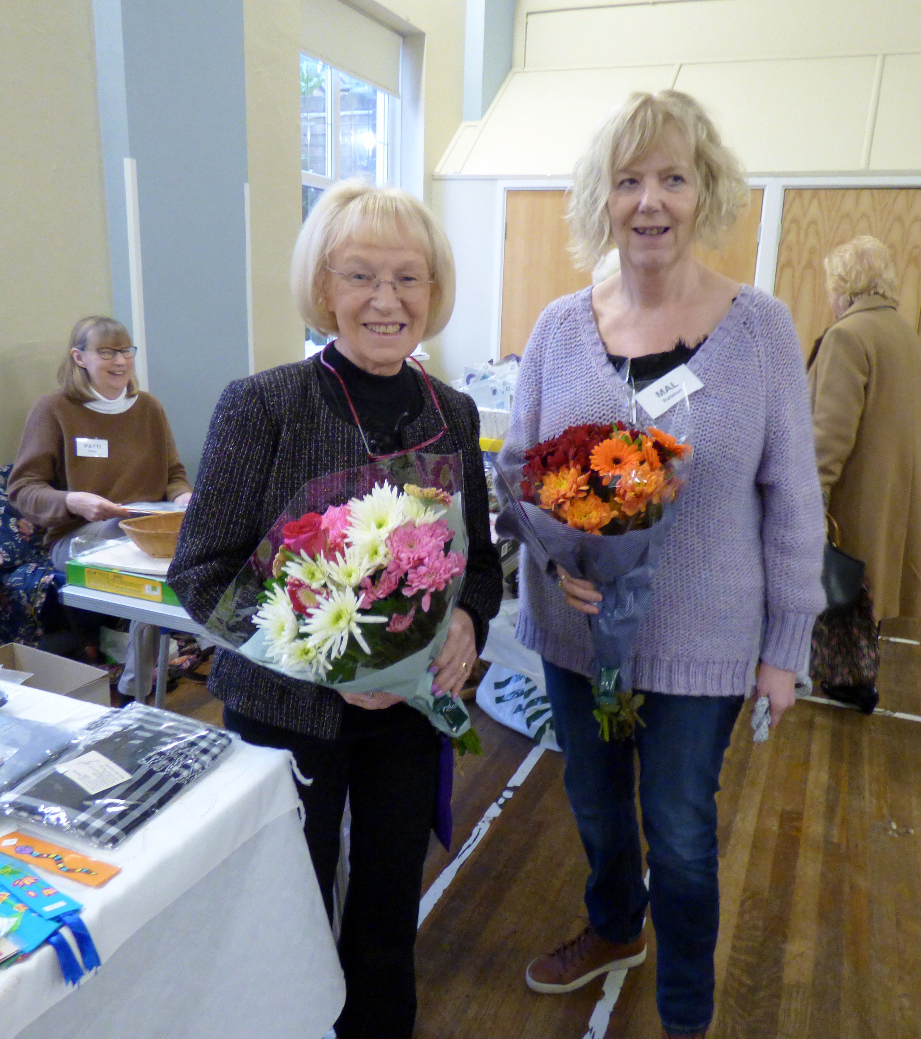 members of YE prestented flowers to YE Leader Mal Ralston and YE Assistant Kathy Green at MEG Christmas Party 2019