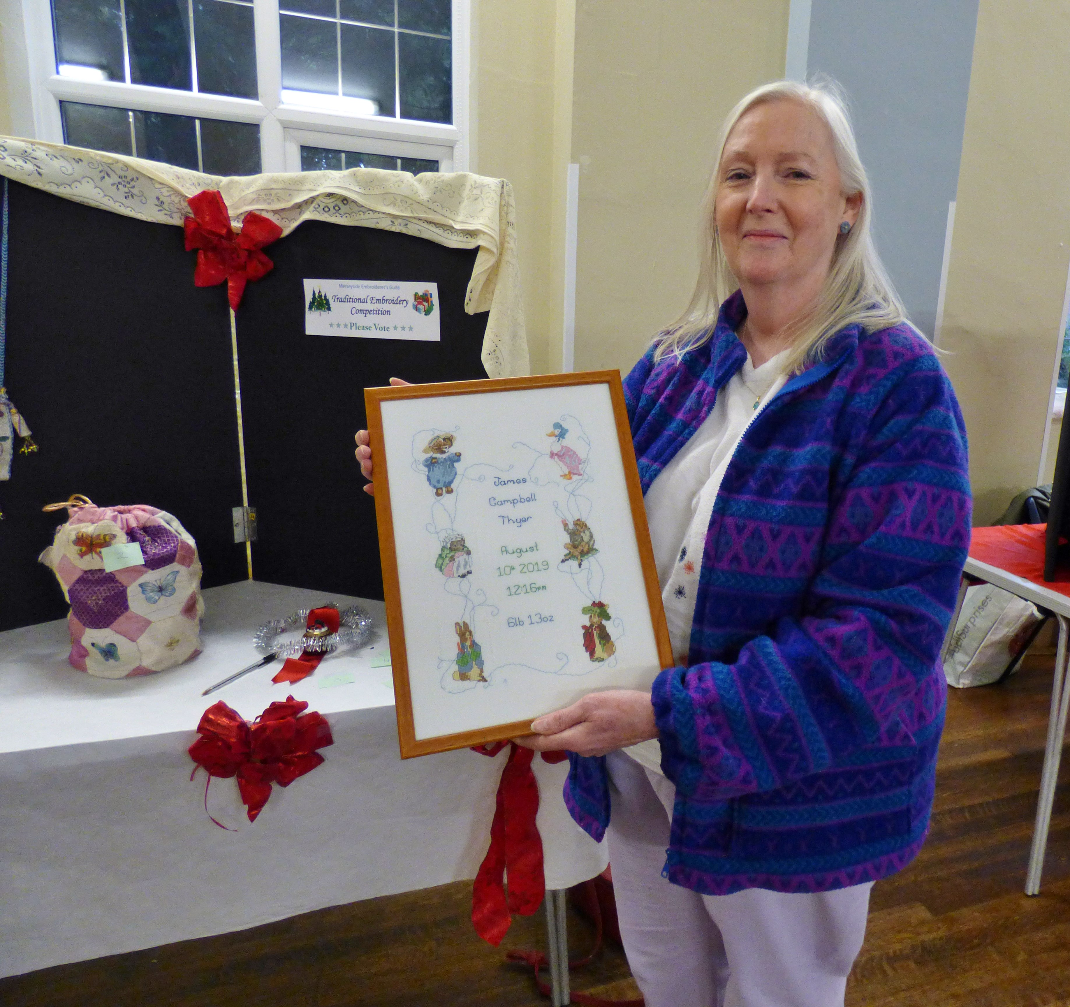 winner of 2019 Traditional Embroidery competition 2019 was Ann Thyer with her beautiful cross stitch birth sampler at MEG Christmas Party 2019