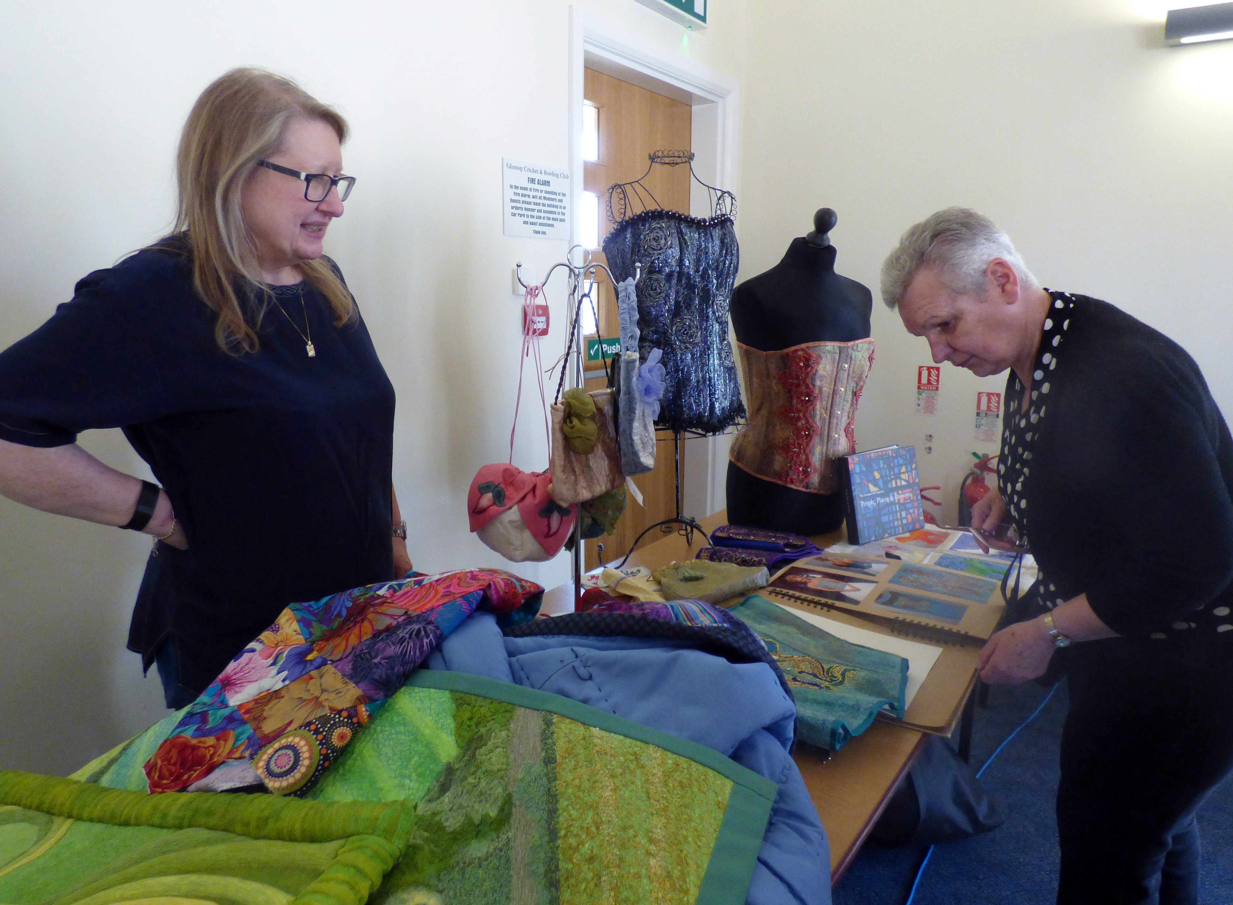 Gill Roberts showing her textiles to a member of Glossop EG, May 2017