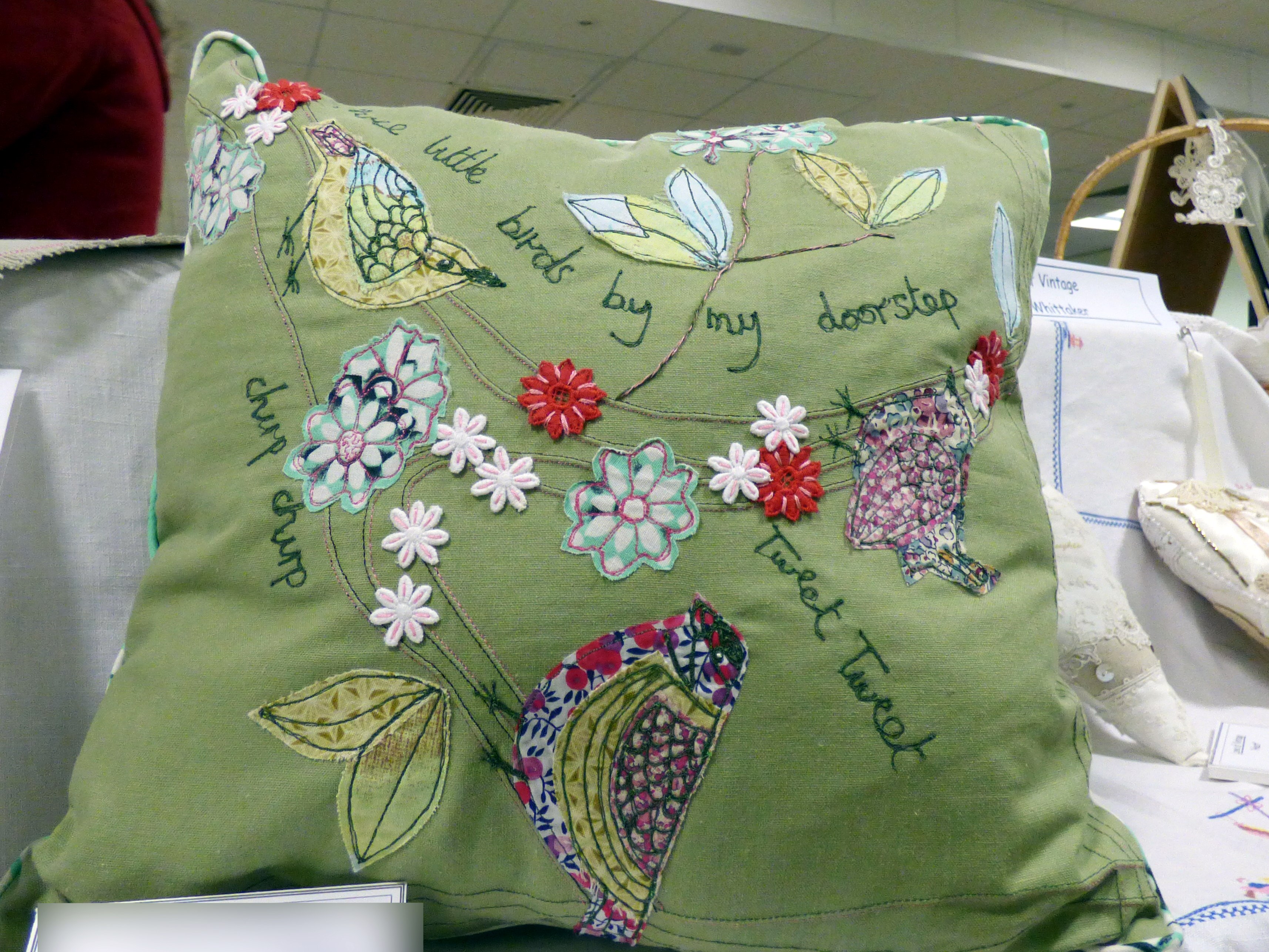 THREE LITTLE BIRDS CUSHION by Ann Reading, Preston EG exhibition, Barton Grange 2017