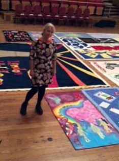 Liz Shelbourne with QUILT by Liz Shelbourne to commemorate 30 years of World Aids Day