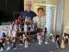 Noelle Thomson with some of her collection of dolls at "Remarkable Dolls in Period Costume Talk for Merseyside Expressive Stitchers Group