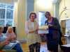 Pat Stock is presented by Kim Parkman with her certificate to celebrate 50 years as a member of Embroiderers' Guild