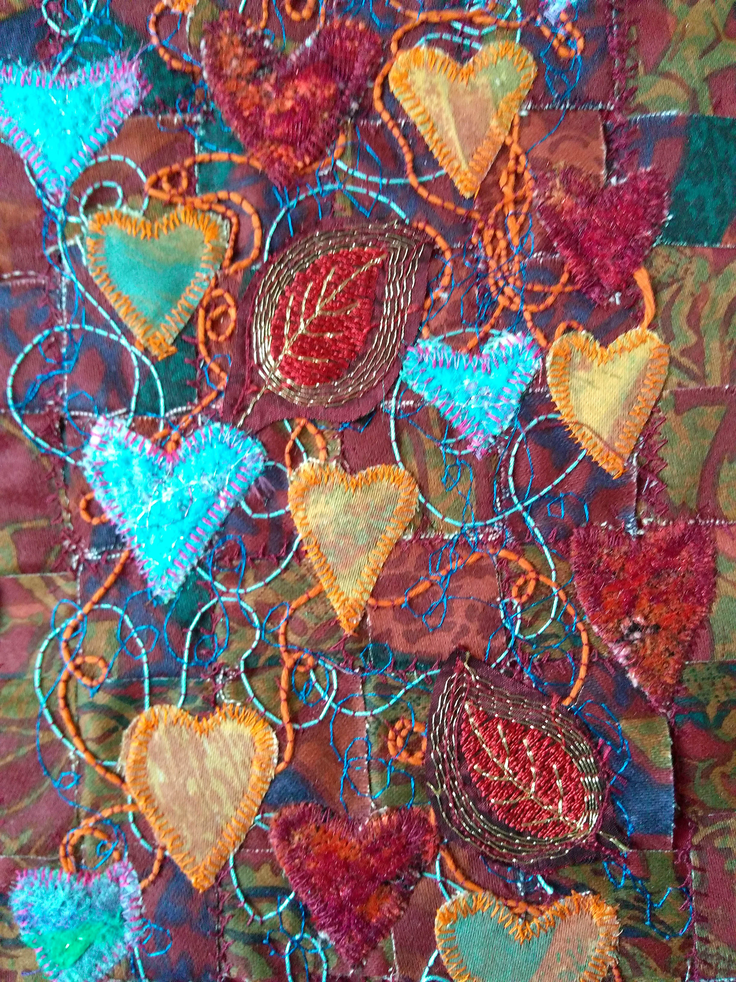 (detail) INTERWOVEN LOVE by Sheila Conchie, Glossop branch, woven strips of fabric, machined at random with added machine embroidery and applique hearts, Rose Bowl competition 2021