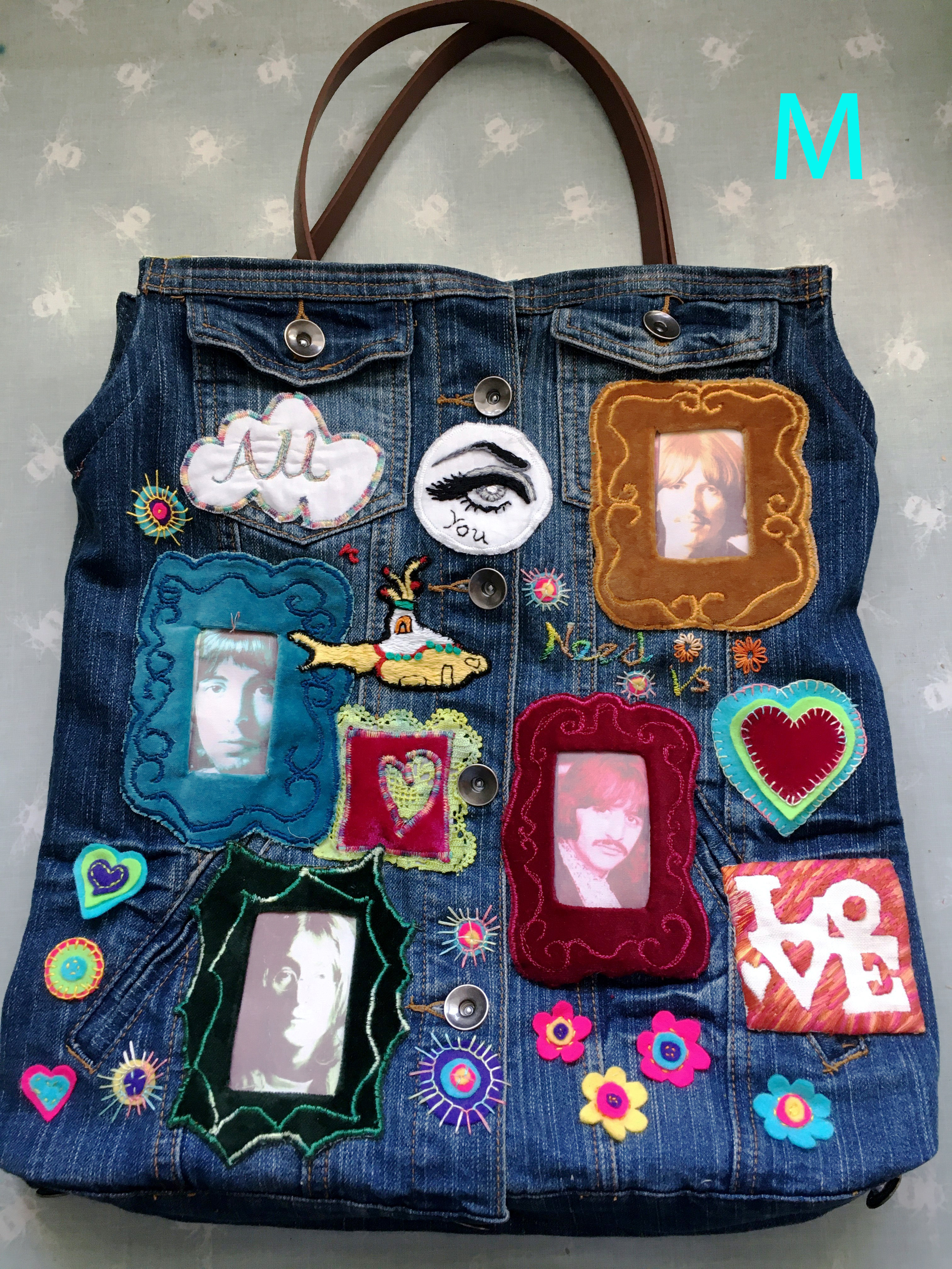 A NOD TO PETER BLAKE, repurposed denim jacket with hand stitching , free machine work and appliqué