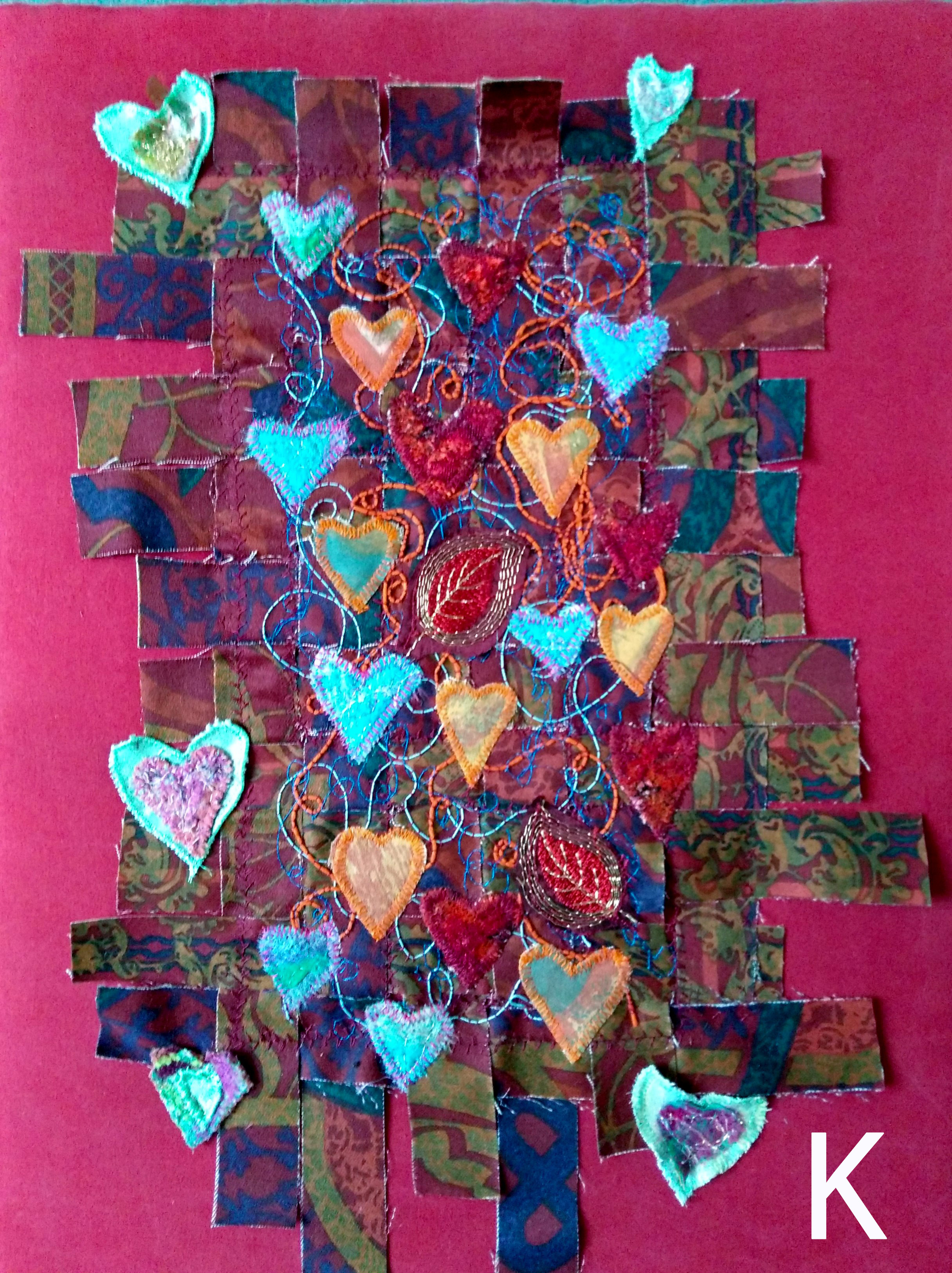 INTERWOVEN LOVE, woven strips of fabric, machined at random with added machine embroidery and applique hearts, Rose Bowl competition 2021