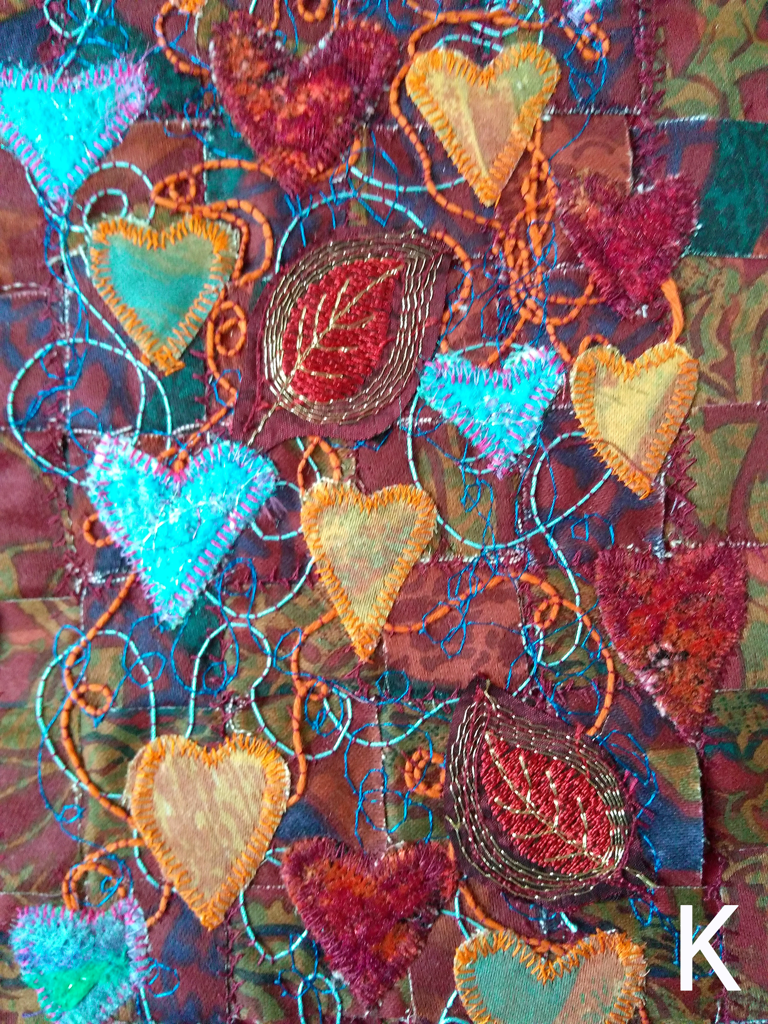 (detail) INTERWOVEN LOVE, woven strips of fabric, machined at random with added machine embroidery and applique hearts, Rose Bowl competition 2021