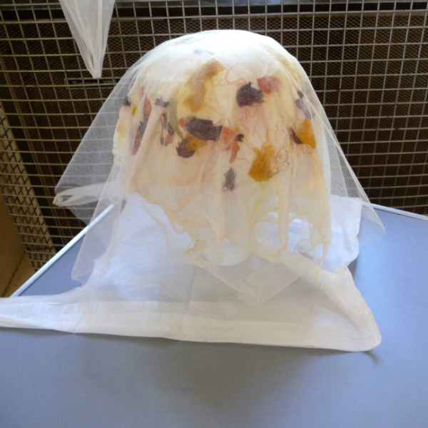 a student\'s 3D vessel is drying. It has a protective layer of net to protect the fibres