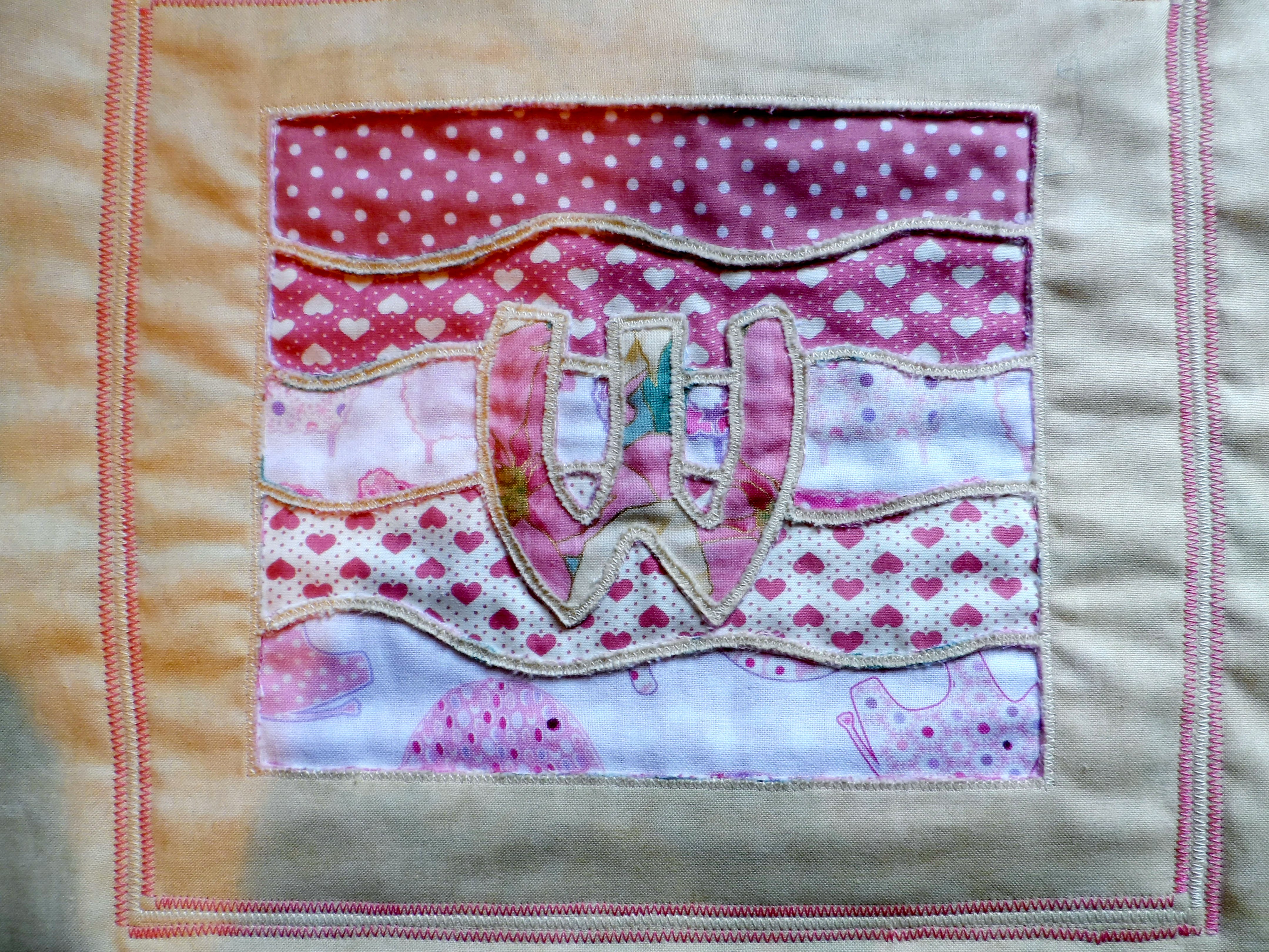 Wendy's reverse applique picture made at a 2013 Workshop