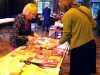 Kathy and Karen are preparing the Sreepur Charity table