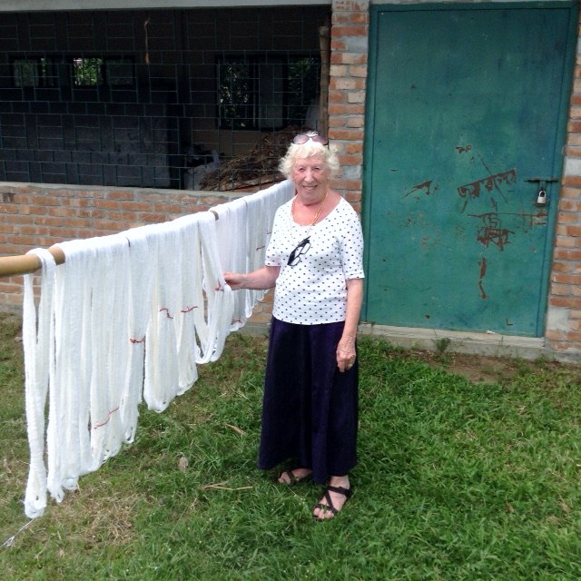 Rubina Porter MBE with silk thread being prepared for weaving in Sreepur Village