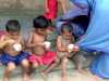 some of the children who live in Sreepur Village are enjoying ice cream - a rare treat!