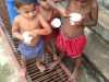 some of the children who live in Sreepur Village are enjoying ice cream - a rare treat!