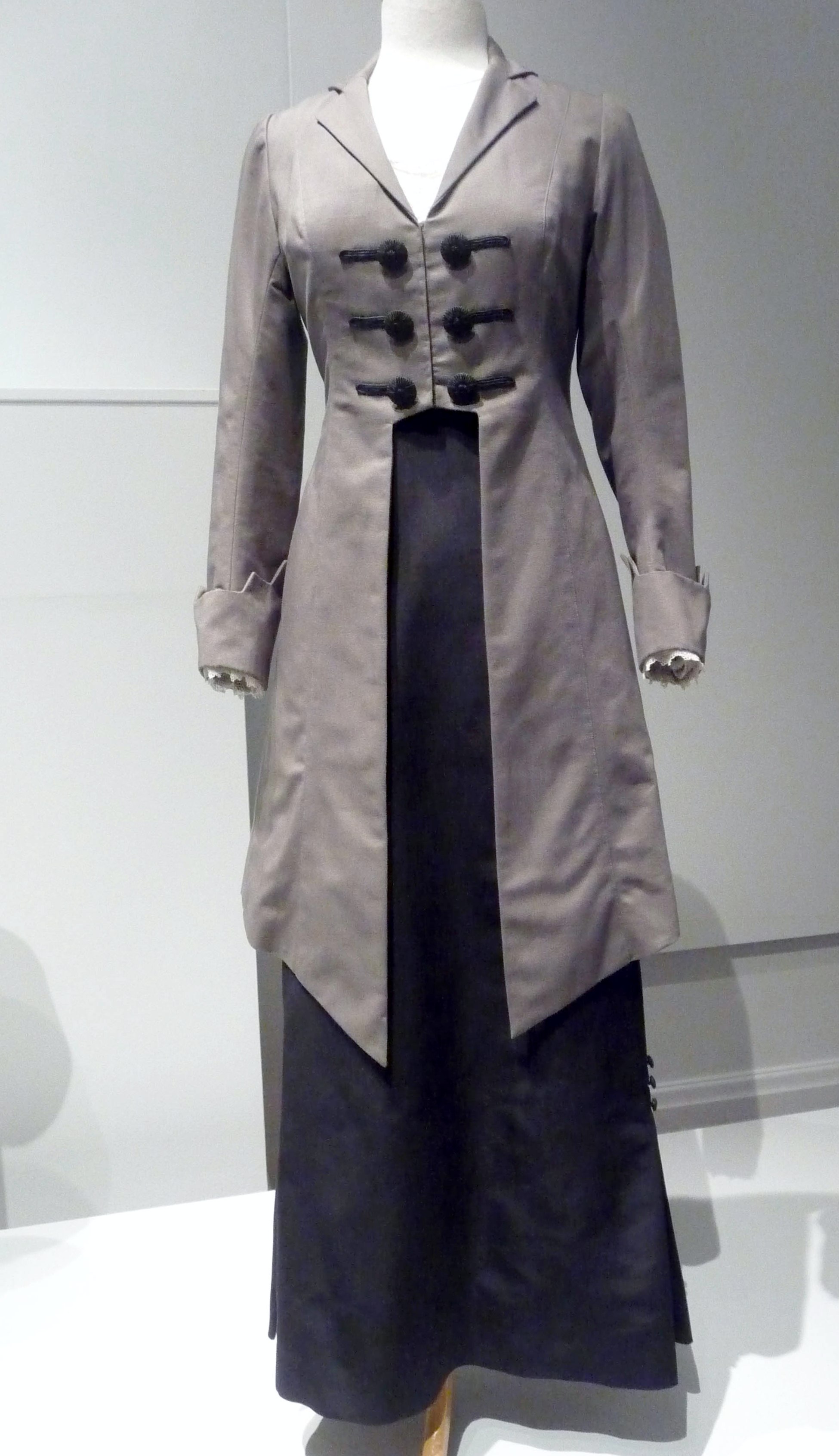 WALKING OUTFIT, gros grain wool and silk,cotton lace inserts, made by Cosprop, 2009. These hobble skirts were very fashionable around 1912. Worn by Samantha Bond as Lady Rosamund Painswick in Downton Abbey.