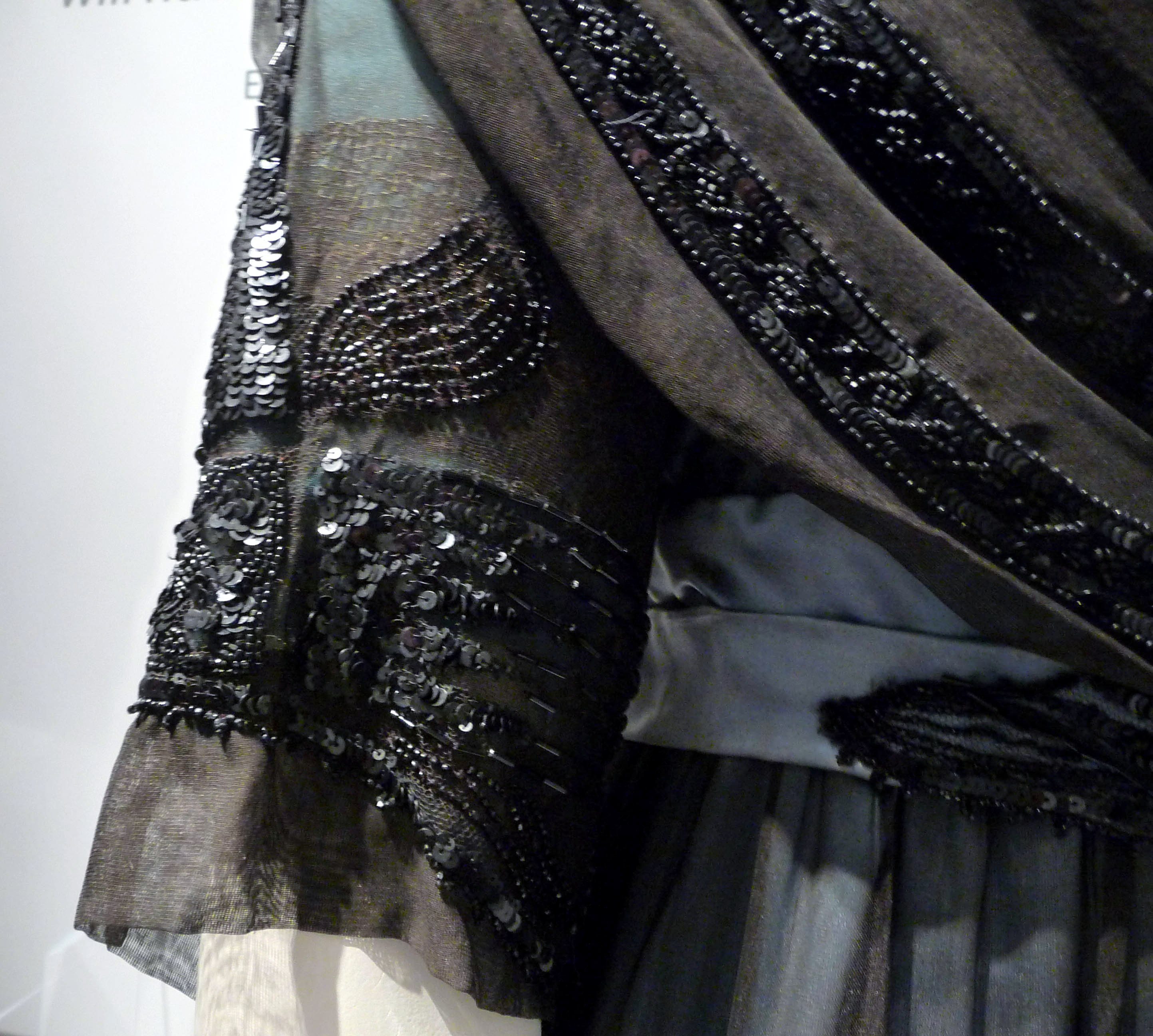 (detail) EVENING DRESS WITH TRAIN, silk satin, silk chiffon and marquisite net, trimmed with celluloid sequins and glass bugle beads, made by T&S Bacon, Liverpool, 1910-12.