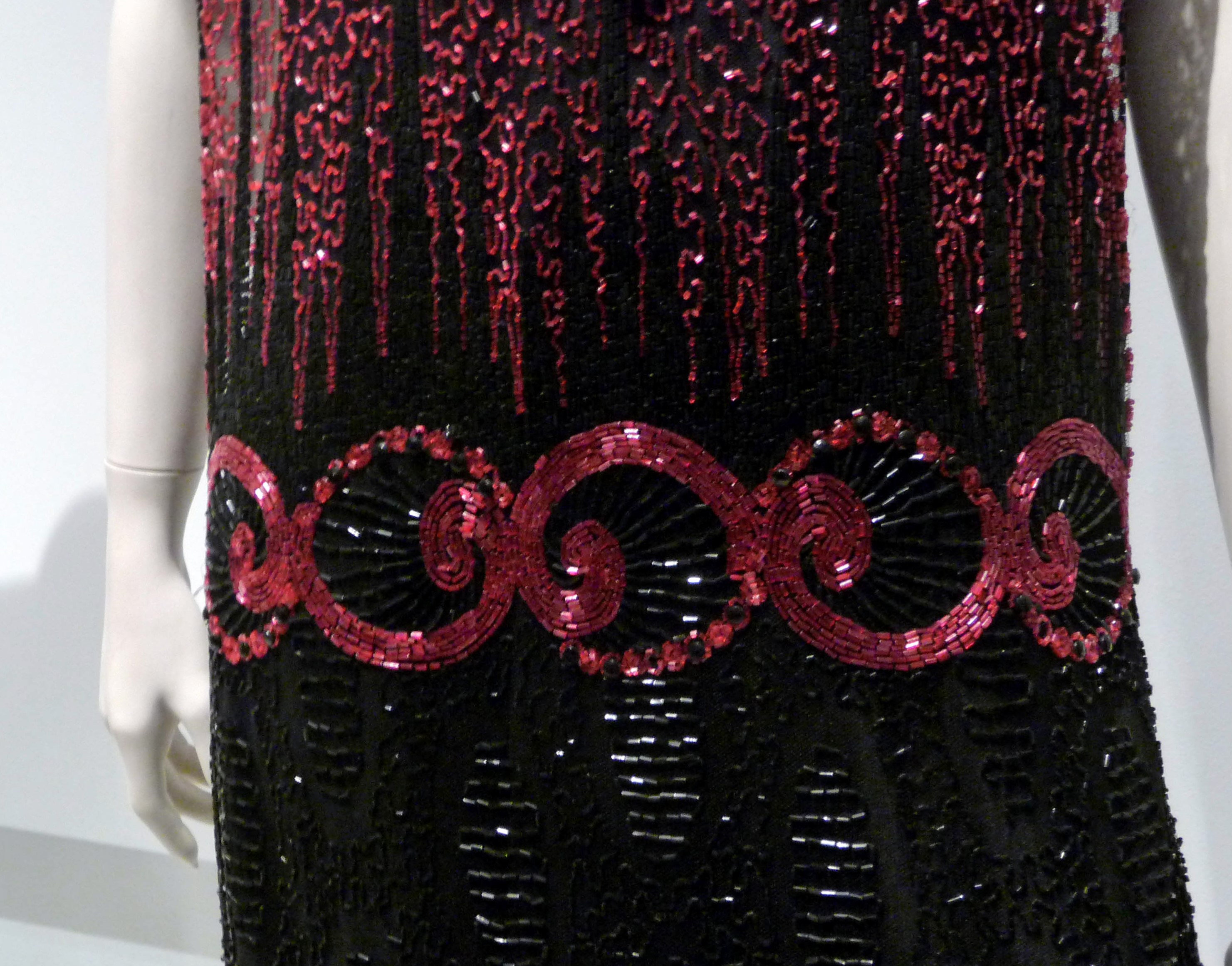 (detail) TUNIC-STYLE EVENING DRESS, silk net embroidered with glass bugle beads, rayon silk under-slip, circa 1921-23.