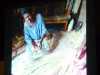 slide by Bobby Britnall showing a Ugandan woman making a broom