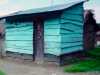 slide by Bobby Britnall showing a small Ugandan house. The colour influenced Bobby Britnall's recent work with barkcloth