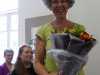 Janet Wilkinson receiving a bouquet as she retires from the MEG Committee