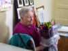 Chris Bennett receiving a bouquet as she retires from the MEG Committee